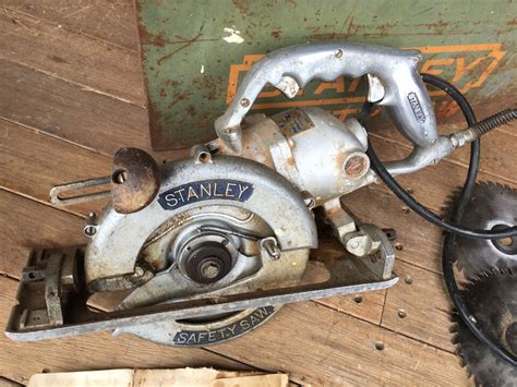 vintage stanley circular saw with metal storage box 